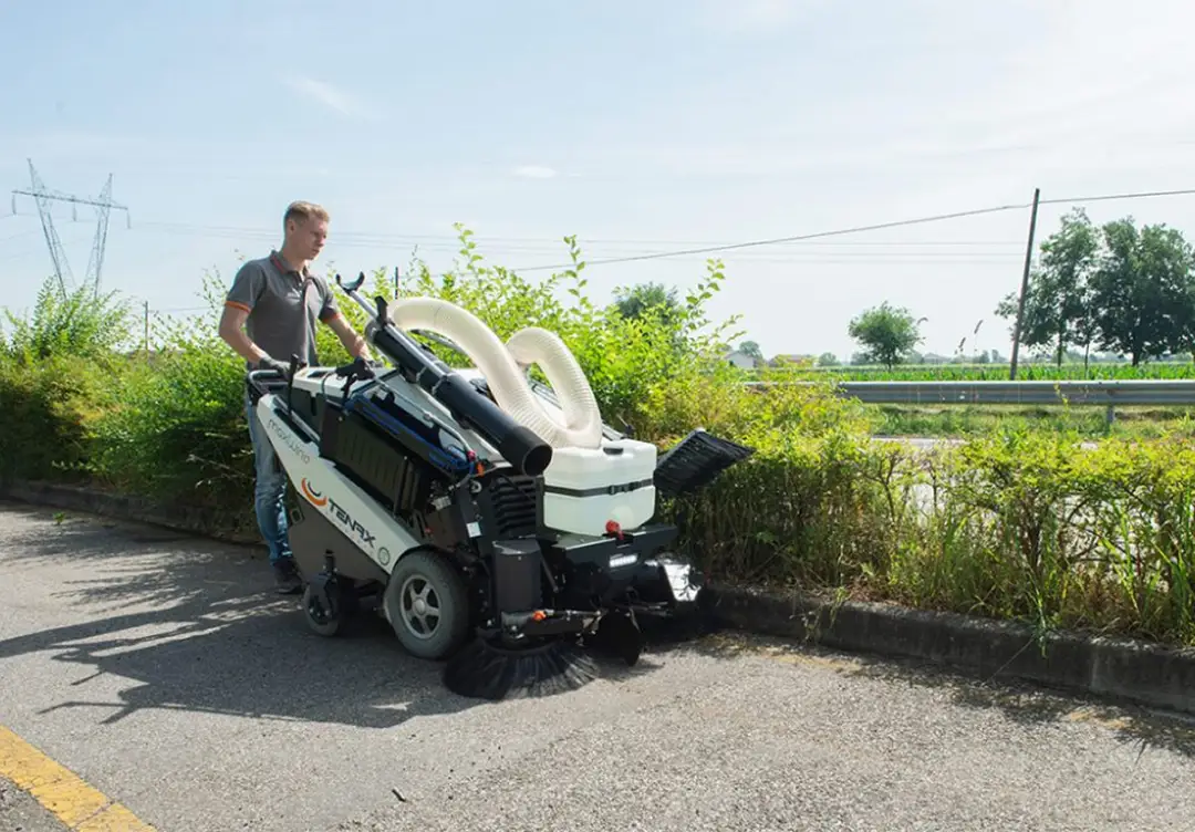 Electra 5.0 street sweeper cleaning a city street.